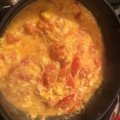 A picture of Fried Tomato with eggs.