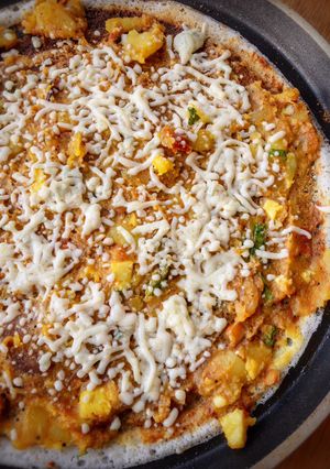 A picture of Open Cheese Masala Dosa.