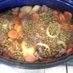 A picture of Pork chop dinner in dutch oven.