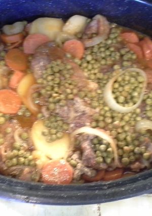 A picture of Pork chop dinner in dutch oven.