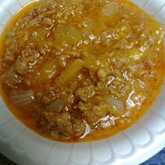 A picture of Creamy coconut curry with sausage and eggplant.