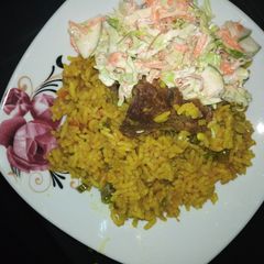 A picture of Fried rice and coslow.