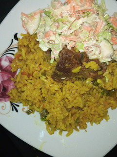 A picture of Fried rice and coslow.