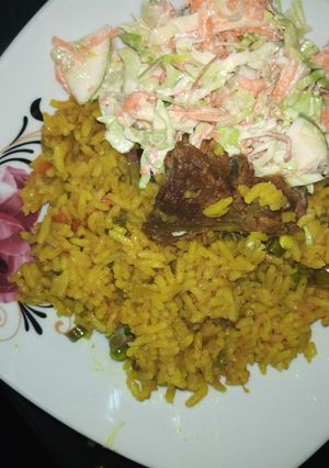 A picture of Fried rice and coslow.