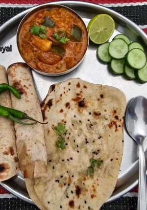 A picture of Naan Bread and Yogurt Onion Bell Pepper Curry.