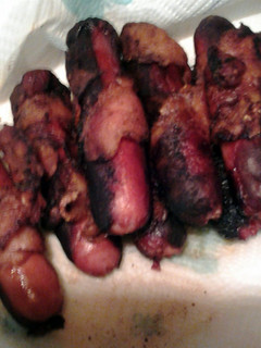 A picture of bacon wrapped hotdogs.