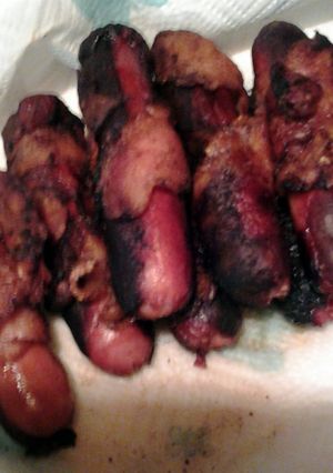 A picture of bacon wrapped hotdogs.