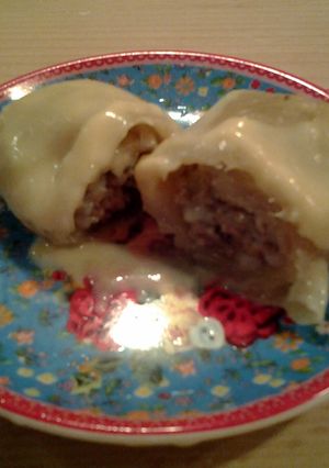 A picture of Stuffed Cabbage (Turkish -Greek recipe) with lemon sauce.