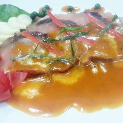 A picture of Kanya's Seared Duck Breast with Red Curry Sauce.