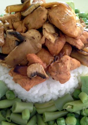A picture of Grilled chicken with steamed vegetables and rice.