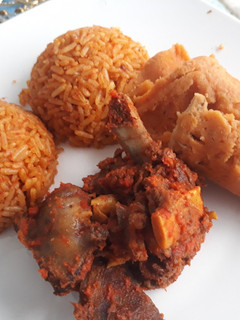 A picture of Jollof rice and moimoi.