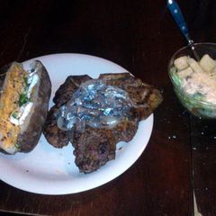 A picture of T-Bone Steak w/ Mushroom & Onion.