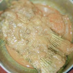 A picture of Rui posto (rohu fish cooked in poppy seeds paste).