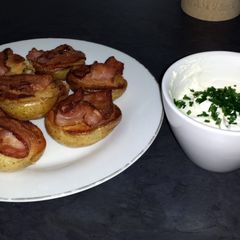 A picture of Baked Potatoes with Bacon and Cheese Toping.