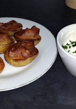 A picture of Baked Potatoes with Bacon and Cheese Toping.