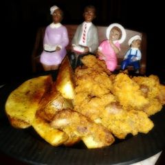A picture of Southern fried livers n gizzard w/garden green onion pot wedges.