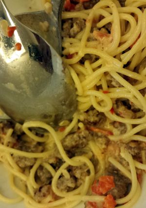 A picture of Pasta with Sausage, Tomatoes and Cream.