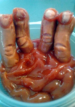 A picture of Bloody Severed Fingers ( hot dogs with ketchup ) halloween.