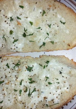 A picture of Crusty bread with ranch and sour cream spread.