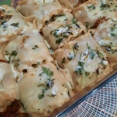 Tikka Lasagna roll ups with cheese sauce A picture of Tikka Lasagna roll ups with cheese sauce.