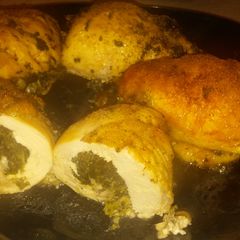 A picture of Roll Chicken breasts with Spinach and Mozzarella Cheese.
