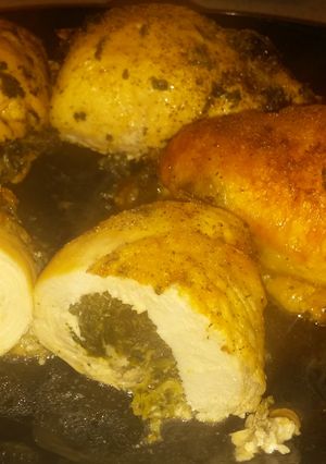 A picture of Roll Chicken breasts with Spinach and Mozzarella Cheese.