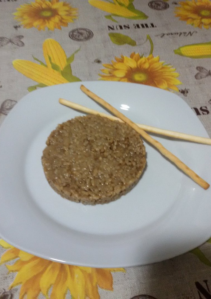Una foto de Risotto de ajo negro y parmesano con thermomix