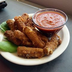 A picture of Fresh fried mozzarella sticks.