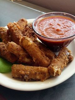 A picture of Fresh fried mozzarella sticks.