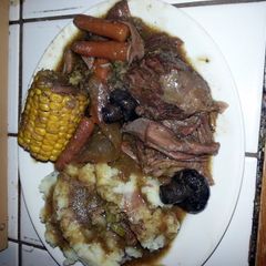 A picture of pot roast & homemade mashed potatoes.