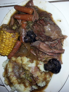 A picture of pot roast & homemade mashed potatoes.