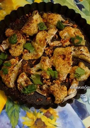A picture of Baked cauliflower topped with parmesan cheese.