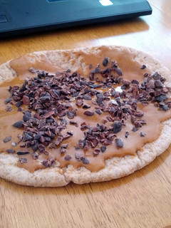 A picture of Almond Buttered Pita Bread with Cocoa Nibs.