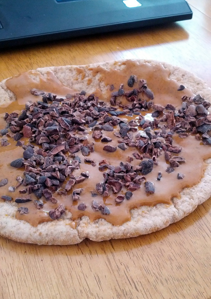 A picture of Almond Buttered Pita Bread with Cocoa Nibs.