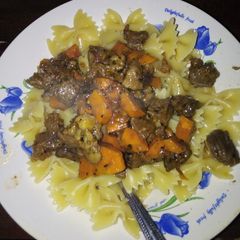 A picture of Pasta and beef carrot ragout.