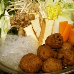 A picture of Warming Hot Pot with Deep Fried Meatballs and Chinese Sauce.