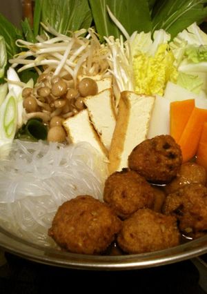 A picture of Warming Hot Pot with Deep Fried Meatballs and Chinese Sauce.