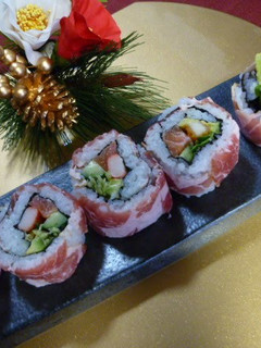 A picture of California Rolls with Cured Ham.