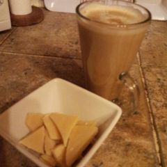A picture of A 'latte' the old fashioned way with smooth caramel sauce and hand made white chocolate chunks.
