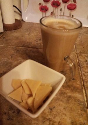 A picture of A 'latte' the old fashioned way with smooth caramel sauce and hand made white chocolate chunks.