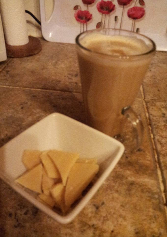 A picture of A 'latte' the old fashioned way with smooth caramel sauce and hand made white chocolate chunks.