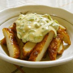 A picture of Easy Satsuma-age Fried Fish Cakes Topped with a Wasabi, Scallion, and Mayonnaise Sauce.