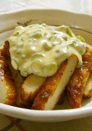 A picture of Easy Satsuma-age Fried Fish Cakes Topped with a Wasabi, Scallion, and Mayonnaise Sauce.