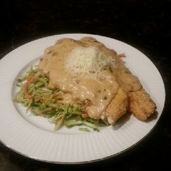 A picture of Brad's trout picatta over Caesar broccoli slaw.