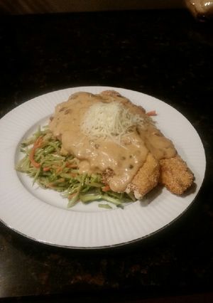 A picture of Brad's trout picatta over Caesar broccoli slaw.