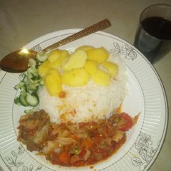 A picture of White rice and potato with Cabbage Sauce.