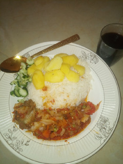 A picture of White rice and potato with Cabbage Sauce.
