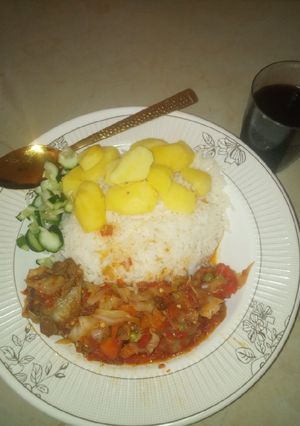 A picture of White rice and potato with Cabbage Sauce.