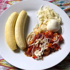 A picture of Unripe plantain with sauce.