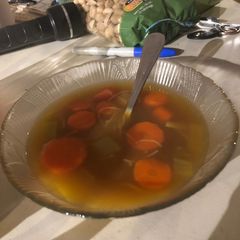 A picture of Carrot leek soup with rice noodles.